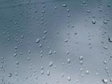 Close up Shot of Conceptual Rain Drops on Glass Window. Can be Used for Wallpaper Backgrounds.