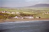 Extensive View of Aberdaron Village of Gwynedd, United Kingdom. Captured with Small Houses on Green Landscape Fronting the Sea.