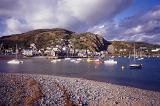Scenic view of Barmouth, Gwynedd, Wales showing the waterfront with boats moored in the sheltered harbour of the bay