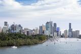 A beautiful panoramic view of Brisbane city skyscrapers and river boats.