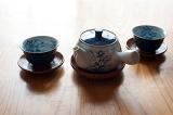 A Japanese teapot and two cups ready for a cup of green tea