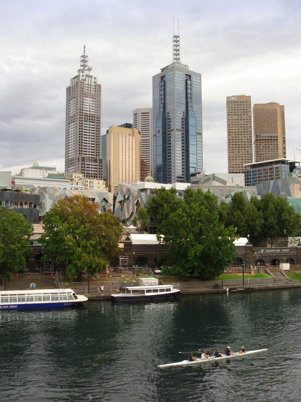 Skyline and Yarra River in Melbourne High Rise Australian Buildings in Front Yarra River with Some people enjoying rowing. Located in Melbourne