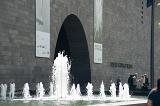 A spouting water feature beside the archway entrance to the National Gallery of Victoria in Melbourne, Australia