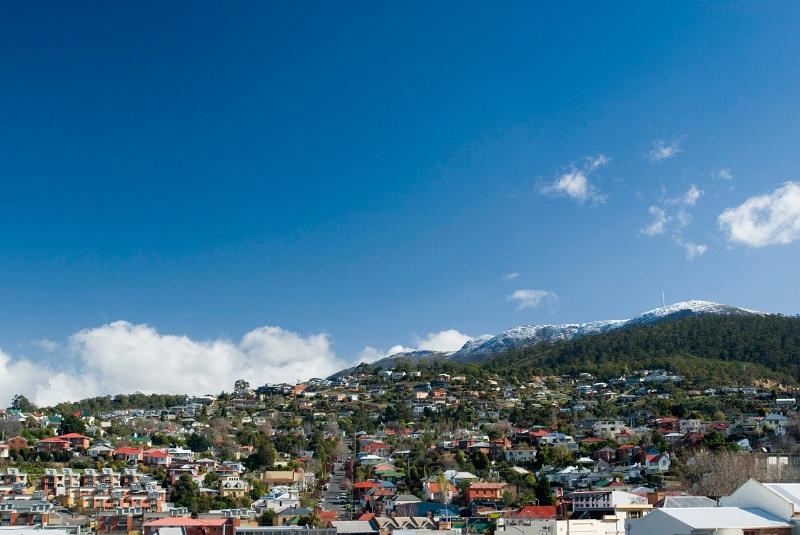 a clear winter day with snow on top of mount wellington, hobrart, tasmania