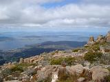 View from the summit of Mount Wellington, Tasmania of the Derwent River estuary and city of Hobart under a cloudy blue sky