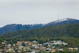 mount wellington and the organ pipes standing above the houses of hobart, tasmania