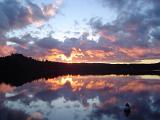 Sunset Behind Forest Hills Overlooking Lake in Algonquin Park, Ontario, Canada