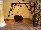 a rum barrel hung from a scale