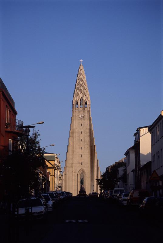 Sunlit Hallgrimskirkja Church Tower in Reykjavik, Iceland Against Clear Blue Sky