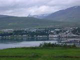 Town of Akureyri on Eyjafjorour Fjord with Overcast Sky and Mountains in the Distance