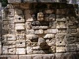 Stone carvings on a ruined building in the Archoeological important Mayan ruins of Chitzen Itza on the Yucatan Peninsula, Mexico