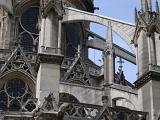 Notre Dame Cathedral architectural detail showing the flying buttress, gargoyles and stone spires, Paris