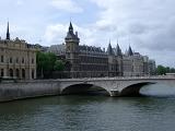 Bridge over the River Seine in Paris with historical French buildings and architecture lining the river bank