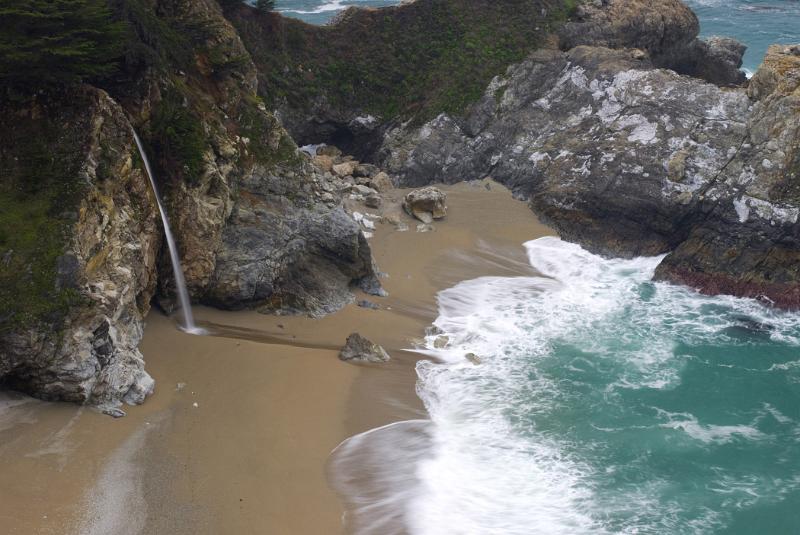 Beautiful McWay Falls in Front the Blue Water Sea in Aerial View