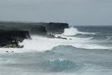 Rugged oceanscape with powerful waves breaking upon coastal cliffs on Big Island , Hawaii