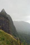 View from the Pali Lookout in Ohau, Hawaaii looking out over the mountain ranges on a rainy misty atmospheric day
