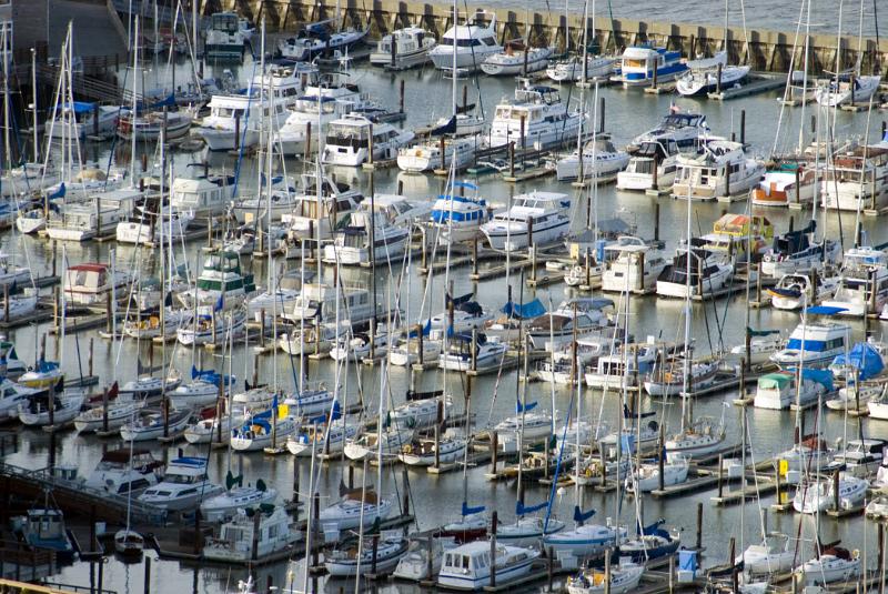 Aerial view of the San Francisco marina with rows of moored pleasure boats and yachts on sheltered water