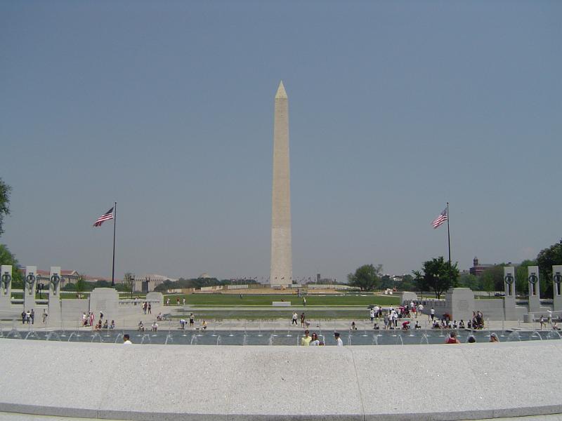 Tourists at Famous Washington Monument. Isolated on Light Blue Gray Background.